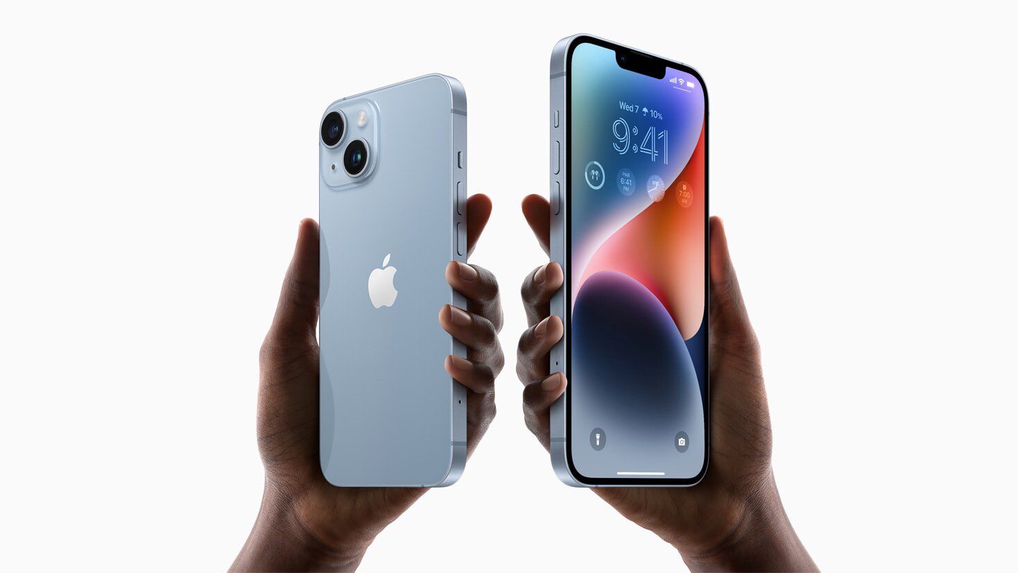 Two hands hold up iPhone 14 and iPhone 14 Plus.  