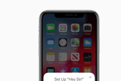 AirPods in case next to iPhone.  