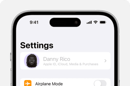 An iPhone showing the owner's name greyed out at the top of Settings.  