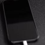 iPhone on charge showing black screen  