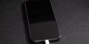 iPhone on charge showing black screen  