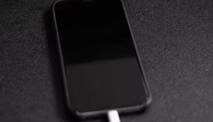 iPhone on charge showing black screen  