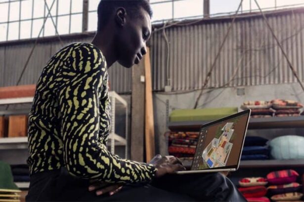 A person uses the new MacBook Air in a studio space.