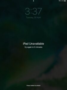 A screenshot of an iPad showing iPad unavailable, try again in 5 minutes message