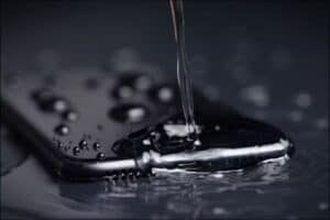 Water pouring onto an iPhone.