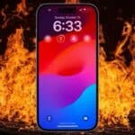 iPhone with fire in the background  
