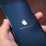 an iPhone booting up and showing the Apple logo.