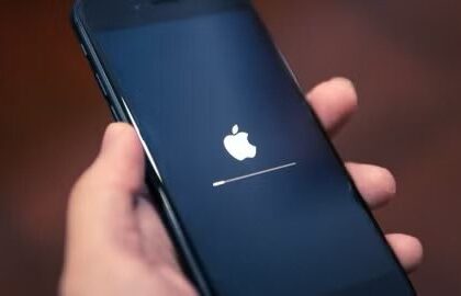 an iPhone booting up and showing the Apple logo.