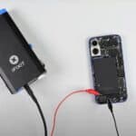 Applying electricity to unglue the iPhone 16 and 16 Plus battery.