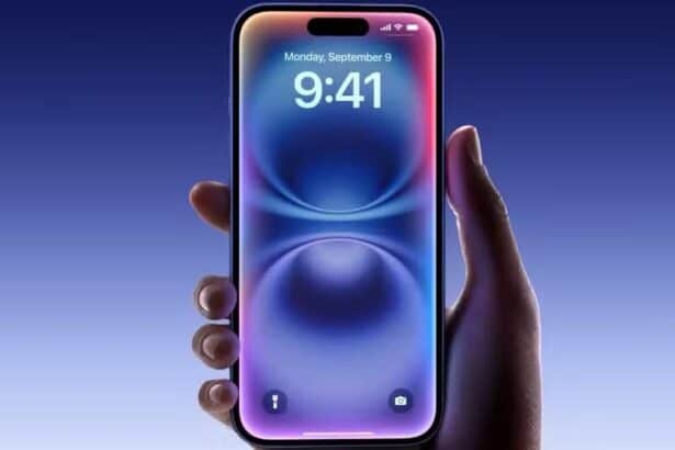 An iPhone 16 in hand with a blue gradient background  