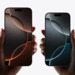 Two models, iPhone 16 Pro Max, iPhone 16 Pro, a hand holds each model, iPhone 16 Pro Max is taller and wider in the hand than iPhone 16 Pro, all screen display, Dynamic Island centered near top, rounded corners.  