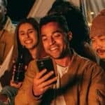 Person Looking at Another Person's Phone