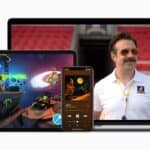 iPad showing Apple Arcade, iPhone playing music, and MacBook showing Apple TV+.