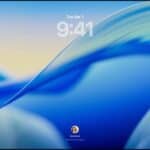 Three Mac models facing forward, 16-inch MacBook Pro in Silver at left with Phone app on screen showing recent contacts, 24-inch iMac in Blue in center macOS Tahoe 26 wallpaper on screen, and 13-inch MacBook Air in Midnight at right, screen shows Spotlight Search over the desktop with Liquid Glass versions of the Dock and various widgets such as Calendar, Clock, and Weather