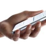 A hand holding iPhone Air, front exterior, side exterior, Sky Blue color, very thin profile, Dynamic Island, buttons: side, Camera Control  