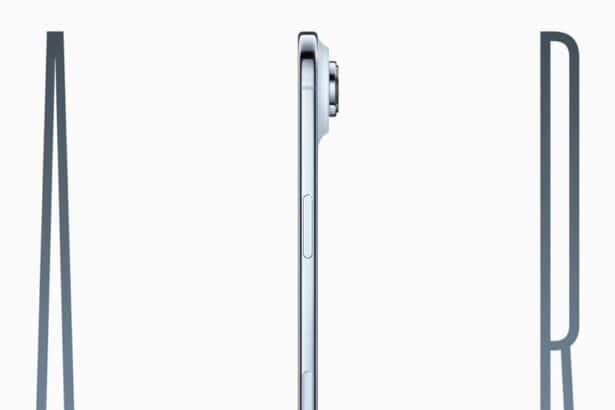 iPhone Air is held up by a hand between the letters “A” and “R,” forming the word “AIR.”