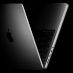 The new 14-inch MacBook Pro shown propped open and angled to the side.