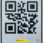 iPhone shown in Camera app with a tappable QR code link.