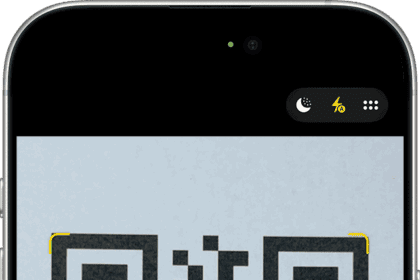 iPhone shown in Camera app with a tappable QR code link.