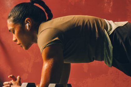 An image of a user wearing AirPods Pro 3 during a workout.