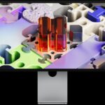 Front of Studio Display XDR with a three-dimensional puzzle-like wallpaper
