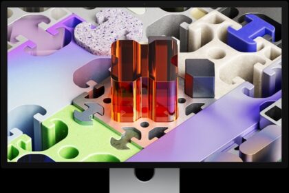 Front of Studio Display XDR with a three-dimensional puzzle-like wallpaper