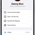 The Apple Account Settings shown with a list of options including personal information, subscriptions, Find My, and more.