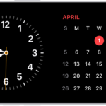 iPhone turned horizontally. The left side of the screen displays a clock and the right side of the screen displays the date.