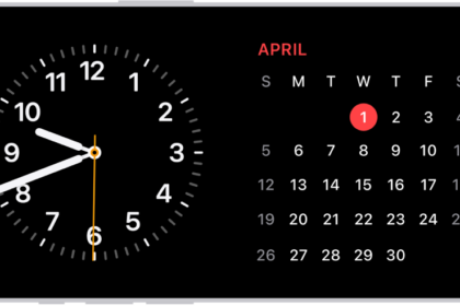 iPhone turned horizontally. The left side of the screen displays a clock and the right side of the screen displays the date.