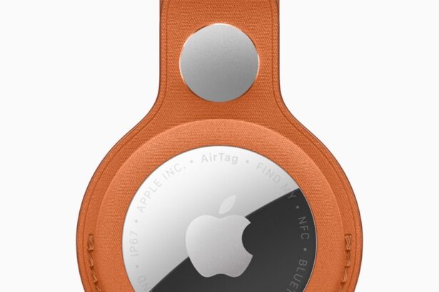 The new AirTag with the FineWoven Key Ring in fox orange.