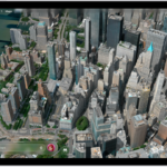 A 3D map in the Maps app, showing a city.