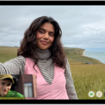 A FaceTime video call in progress, showing one participant at the bottom left. An image of three other participants fills the rest of the screen. At the bottom right are the Camera, Microphone, More, and End Call buttons.