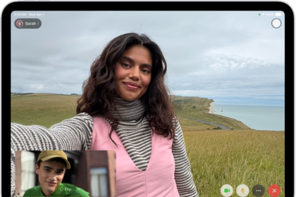 A FaceTime video call in progress, showing one participant at the bottom left. An image of three other participants fills the rest of the screen. At the bottom right are the Camera, Microphone, More, and End Call buttons.