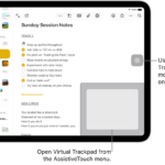 An iPad with a virtual trackpad displayed in the corner of the screen. Also on the screen are the AssistiveTouch menu (which is used to open the trackpad) and the pointer (which is controlled by the trackpad).