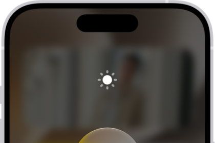 The iPhone Home Screen with Dark Mode on.