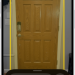 The Magnifier app is open and a door is being detected. A description shows how far away the door is.
