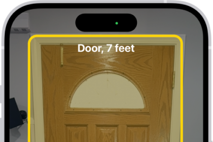 The Magnifier app is open and a door is being detected. A description shows how far away the door is.