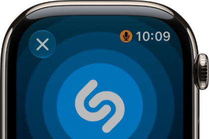A screen showing the title and artist of a song identified by Music Recognition. The play button is at the bottom right.