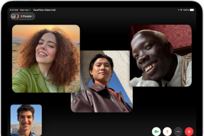 A Group FaceTime call showing four participants in individual tiles at the top of the screen. Two additional participants appear together in a tile at the bottom left. At the bottom right are FaceTime controls: the Video, Microphone, More, and End Call buttons.