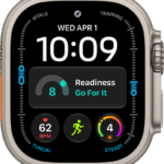The Modular Ultra watch face showing elevation on the left and right (feet on the left and meters on the right), Music, Compass, and Compass Waypoints complications along the top, a digital clock below, a Compass Heading complication in the middle, and the Messages, Sunrise, and Workout complications near the bottom. At the very bottom is the current elevation.