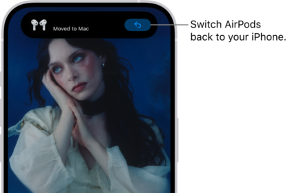 The Lock Screen on iPhone with a message at the top reading "Moved to Mac" and a button to switch the AirPods back to iPhone.