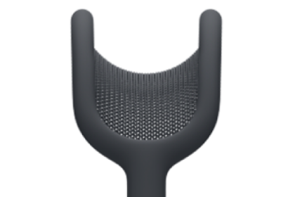 A USB-C charging cable connecting to the bottom of the right earphone of AirPods Max 2.