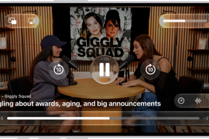 A video podcast in the Podcasts app expanded to full-screen video mode. At the top of the screen are display options and the volume control. The Skip Back, Pause, and Skip Forward buttons appear in the center of the screen. Episode details, the progress bar, and controls for playback speed, enhanced dialogue, and subtitles appear at the bottom of the screen.