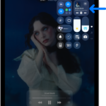 The iPad Control Center showing an arrow pointing to the audio card where you can control music from the Lock Screen or when using another app.