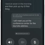 A phone call in the Phone app showing a conversation translated from German to English.