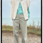 A person's height being measured in the Measure app, with the height measurement showing at the top of the person's head. The Take Picture button is near the lower-right corner for taking a picture of the measurement. The green Camera In Use indicator appears at the top.