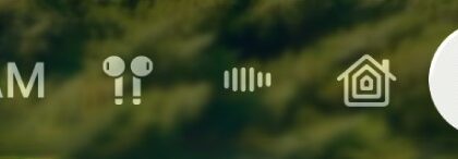 The top-right part of Control Center on Apple TV 4K. AirPods appear to the right of the time.