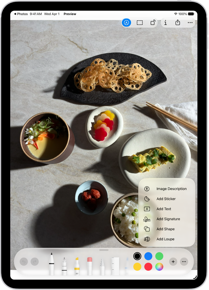 An image open in the Preview app. A menu shows options that can be added to it, such as stickers and text. The Markup, Info, Share, and More buttons appear at the top of the screen, and annotation tools appear at the bottom of the screen.