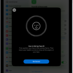 The Face ID recognition setup screen. A smiley face is showing on the screen, enclosed in a circle. Text below instructs the user to move their head slowly to complete the circle. A button for Get Started appears near the bottom of the screen.