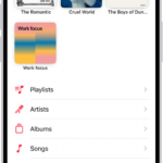 The Library tab showing a list of categories including Playlists, Artists, Albums, Songs, and Downloaded. The Recently Added heading appears below the list. The MiniPlayer showing the title of the current song and the Pause and Next buttons appear near the bottom.
